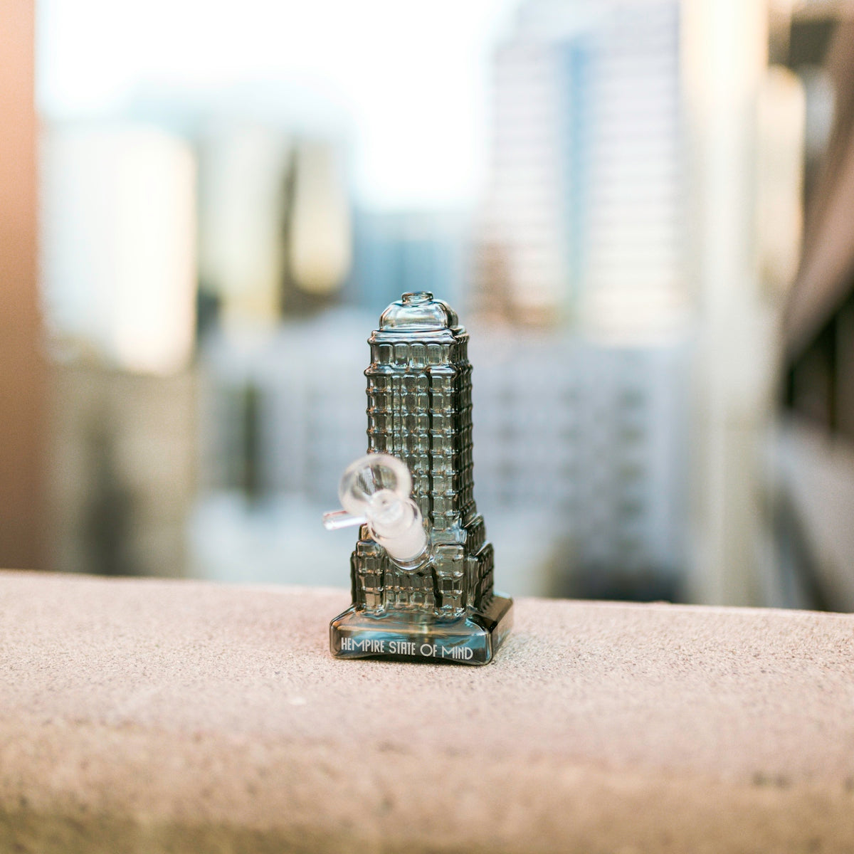 silver lego toy on brown table